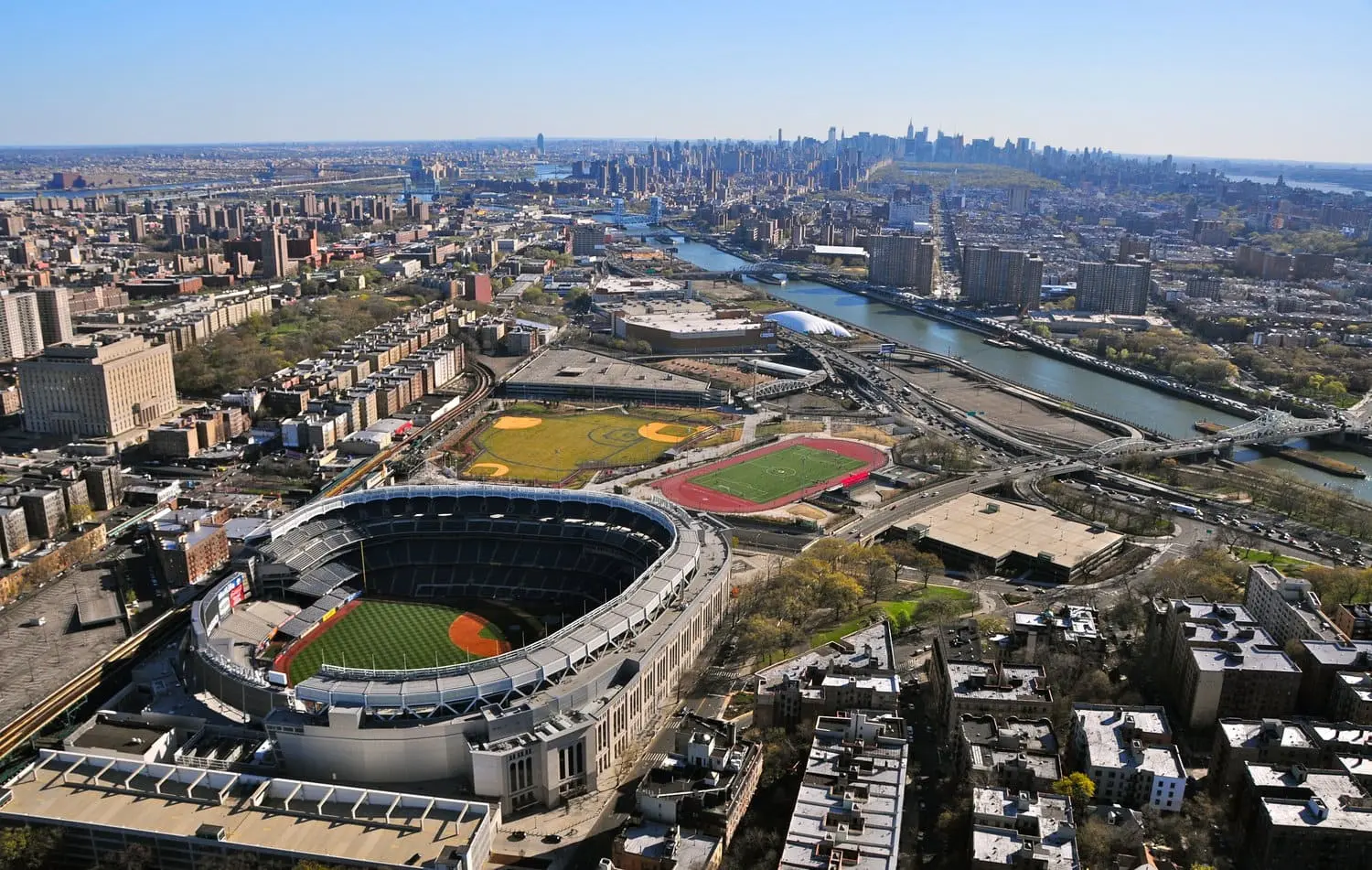 Aerial view of the Bronx, showcasing its urban landscape, prominent landmarks, and interconnected roadways.